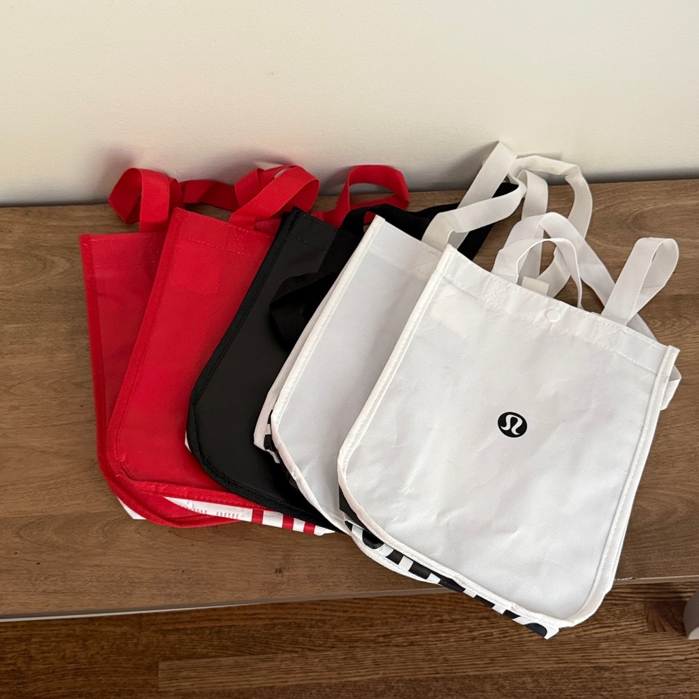 Assortment of Lululemon Tote Bags. 5 small. 1 large.